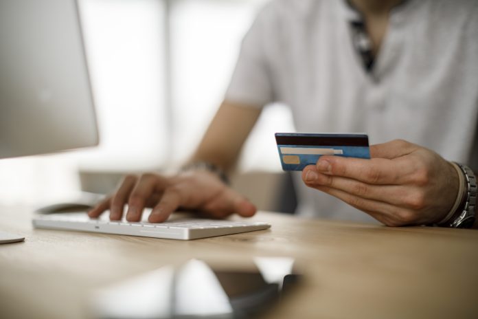 man using credit card online