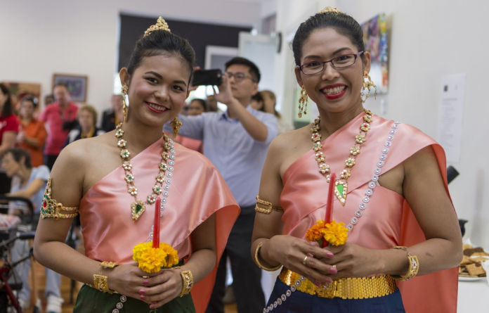 two women dressed up in cultural outfit