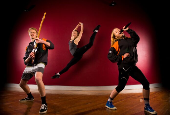 ASPIRE performers Jacob Armit, Hannah Smith and Chloe Anson-Smith rehearsing at St Pius X High School Adamstown.