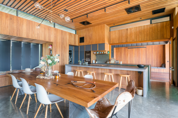 timber accent walls in dining area and kitchen