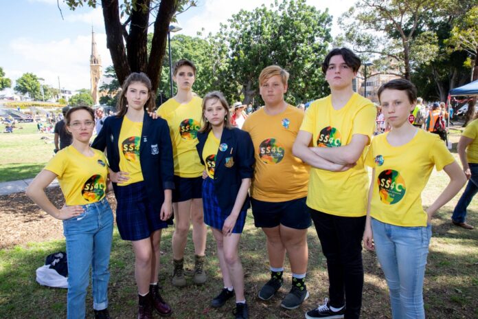 Students Angie Devorshine, Aleeyah Clifford, Bo Vincent, Abbey Manning, Michael Campbell, Kalleb Pritchard and Alexa Stuart at the climate strike in Civic Park