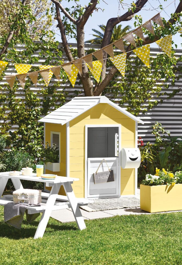 cubby house painted yellow