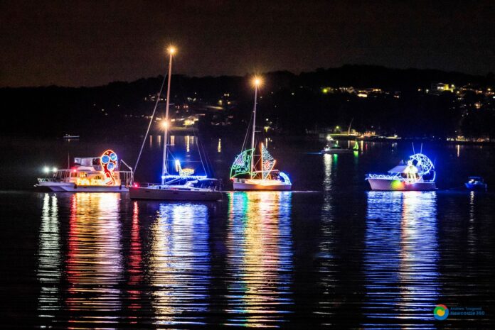 boats with colourful lights on the water