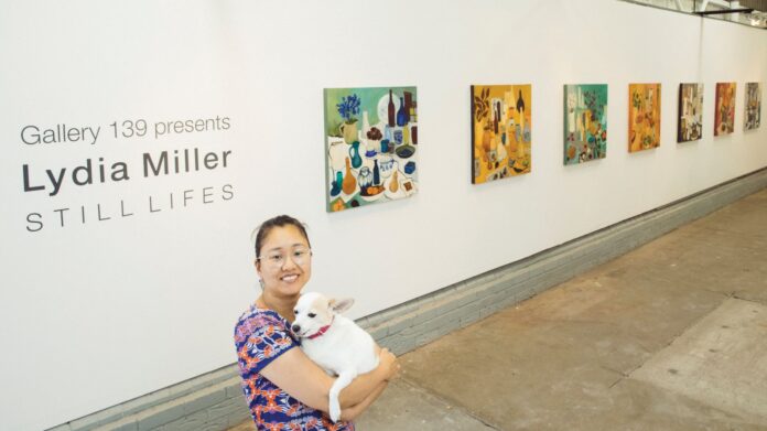 Ahn Wells and her dog at gallery