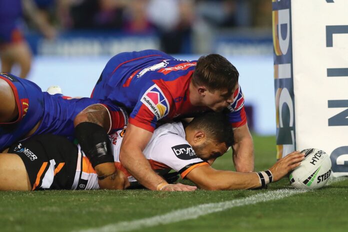 Benji Marshall scores a try for the Wests Tigers at McDonald Jones Stadium