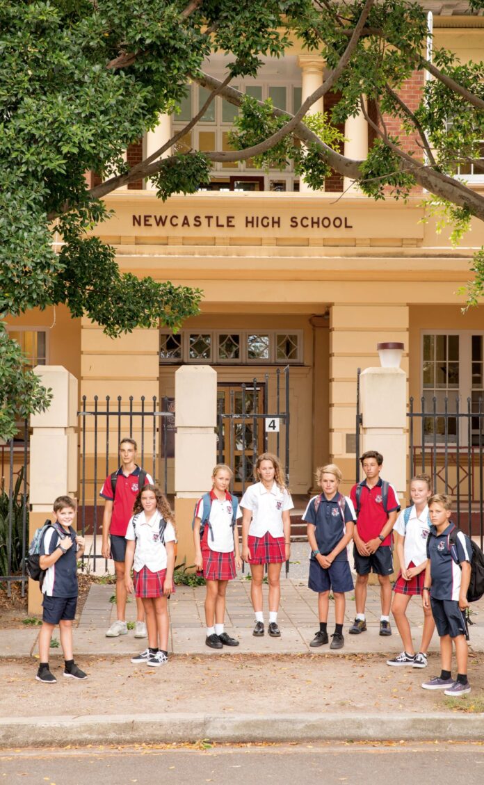 students out front of school