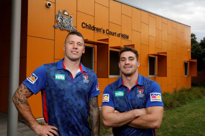 Newcastle Knights players in front of childrens court