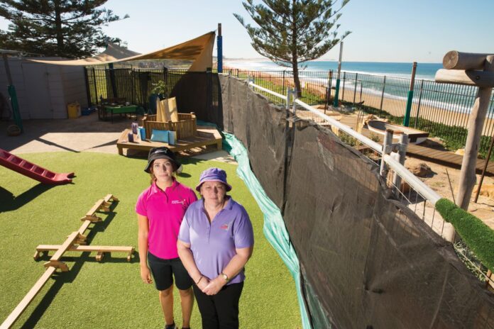 two women in playground that was damaged by storms