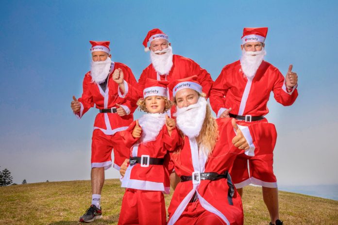 people dressed up as santa