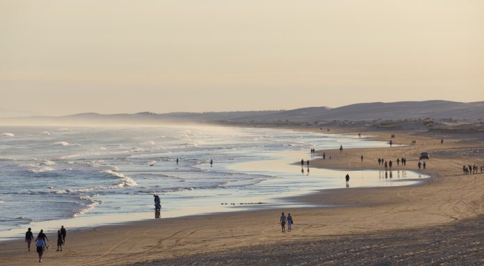 wide shot of people at the beach