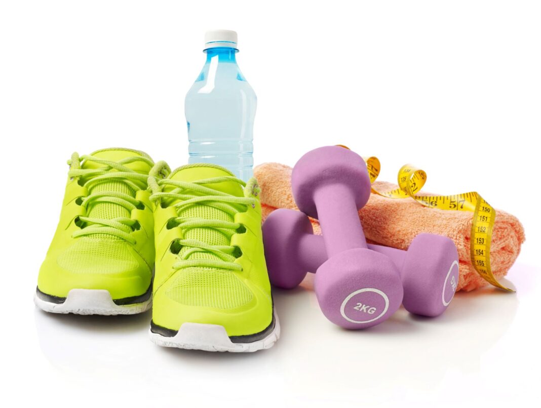 running shoes, drink bottle, weights and a towel