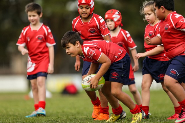 young kids playing rugby