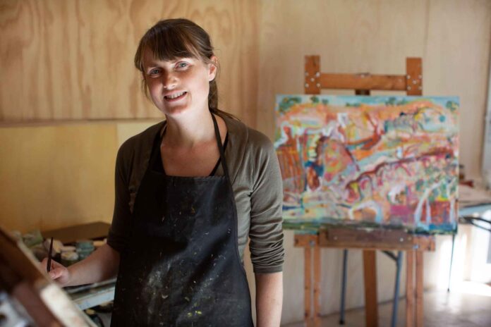 Artist Michelle Teear at her studio in Blackalls Park.