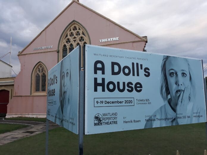 A dolls house poster outside