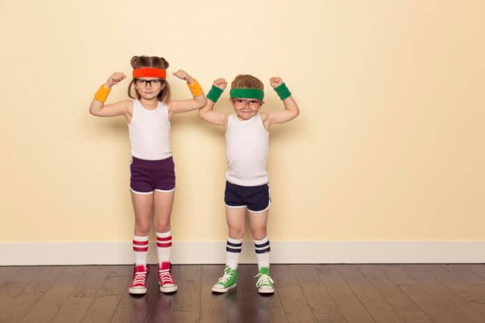 A boy and girl dressed as 80s nerds are ready to sweat to stay fit during this workout