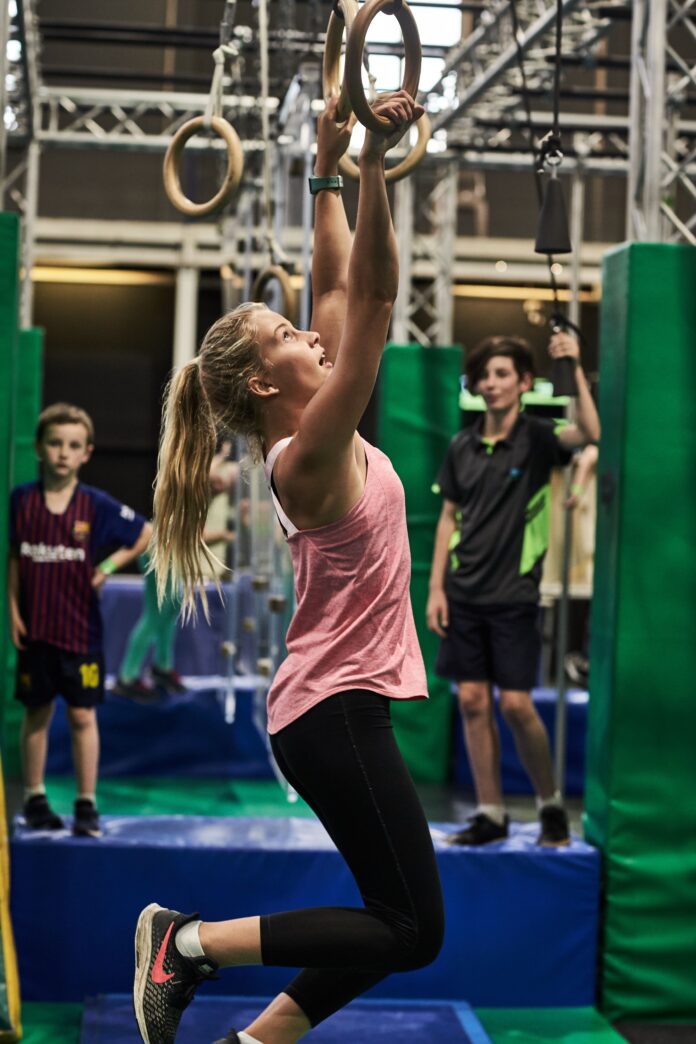 young girl on rings