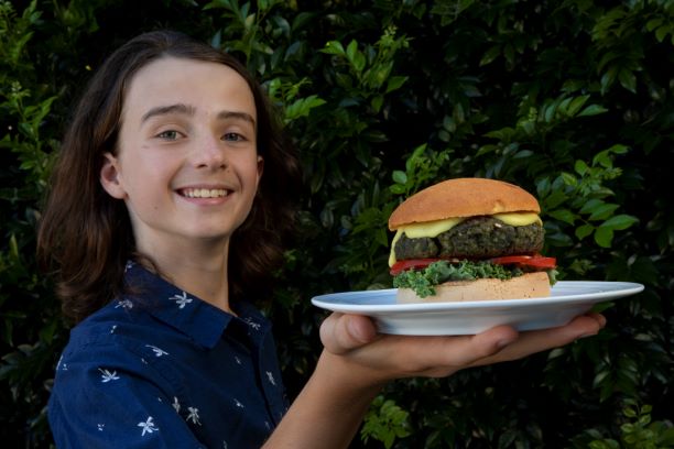 Rylan holding large burger
