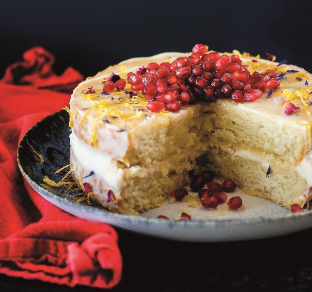 Vegan vanilla sponge cake with cream ‘cheese’ icing, maple and pomegranate by Katrina Meynink