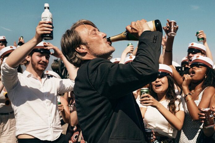 Mads Mikkelsen having a drink in Another Round