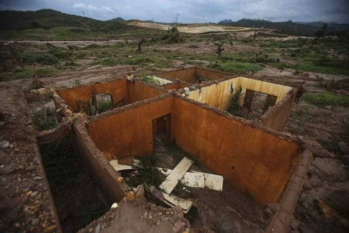 The remains of a house destroyed in the Bento Rodrigues dam disaster in Brazil in 2016