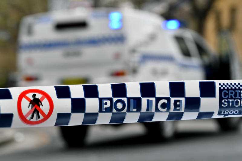 Police tape restricts access to a street in NSW