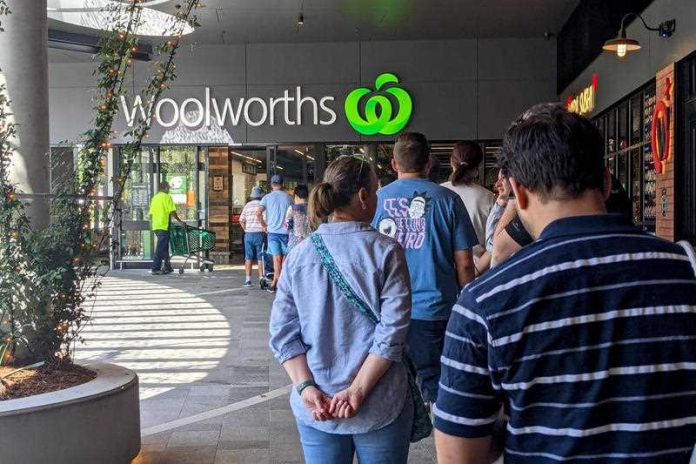 Shoppers line up outside a Woolworths store at Montague Markets West End in Brisbane