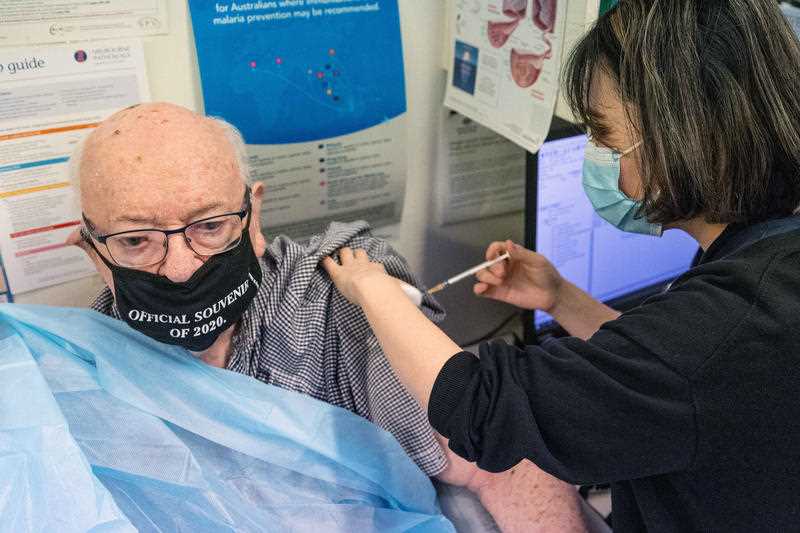 An elderly man receives his second Covid vaccine in Melbourne