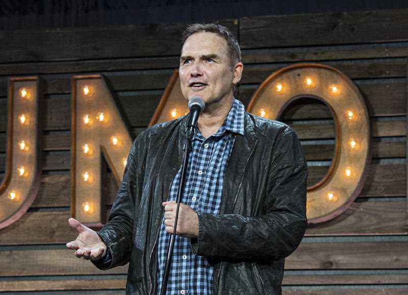 Norm Macdonald on stage, has died at 61