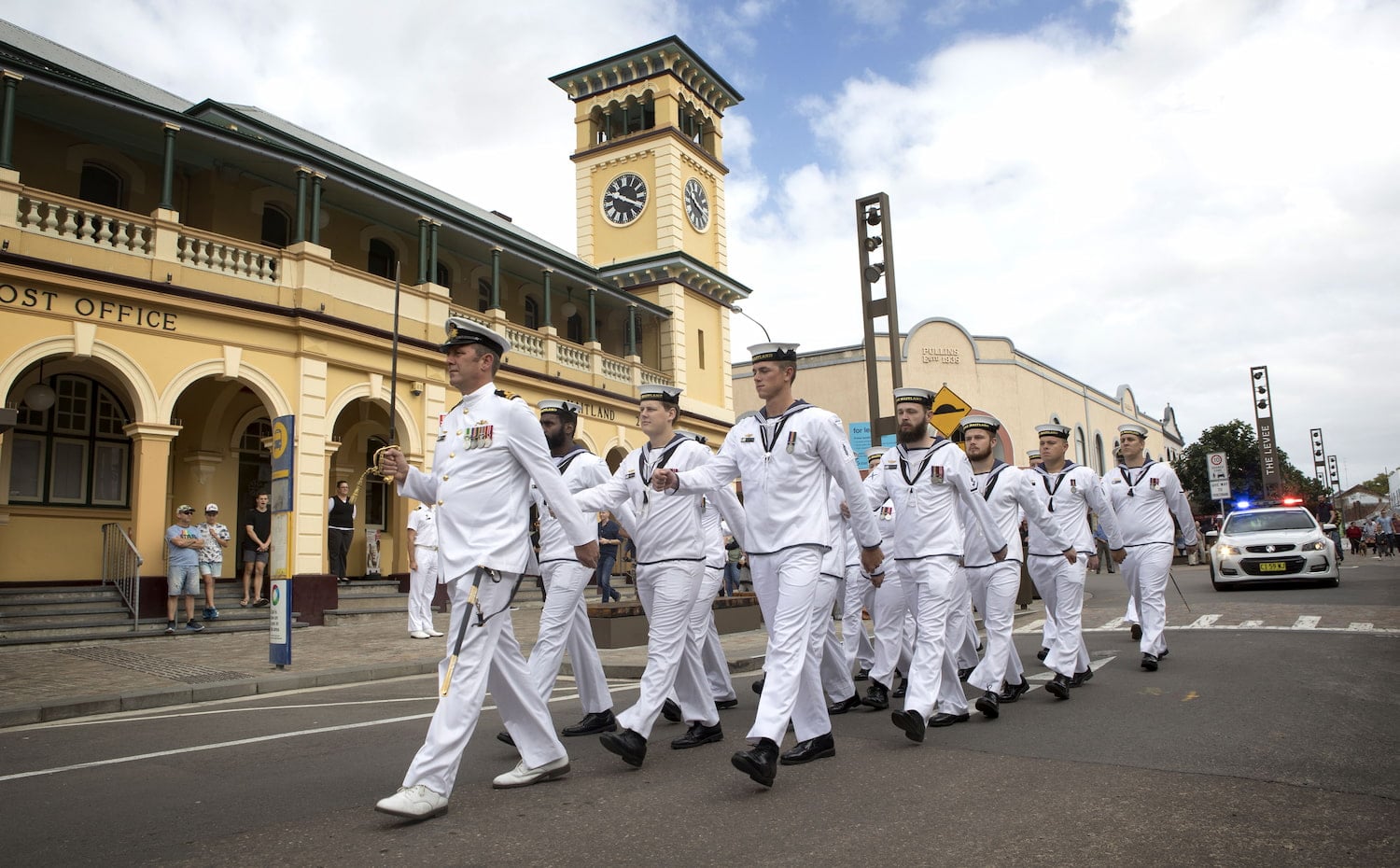 Navy officers marching through Maitland